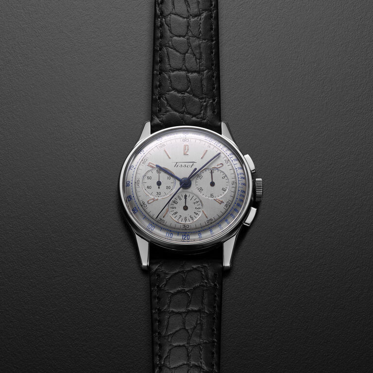 Vintage Tissot watch with black leather strap and steel case.