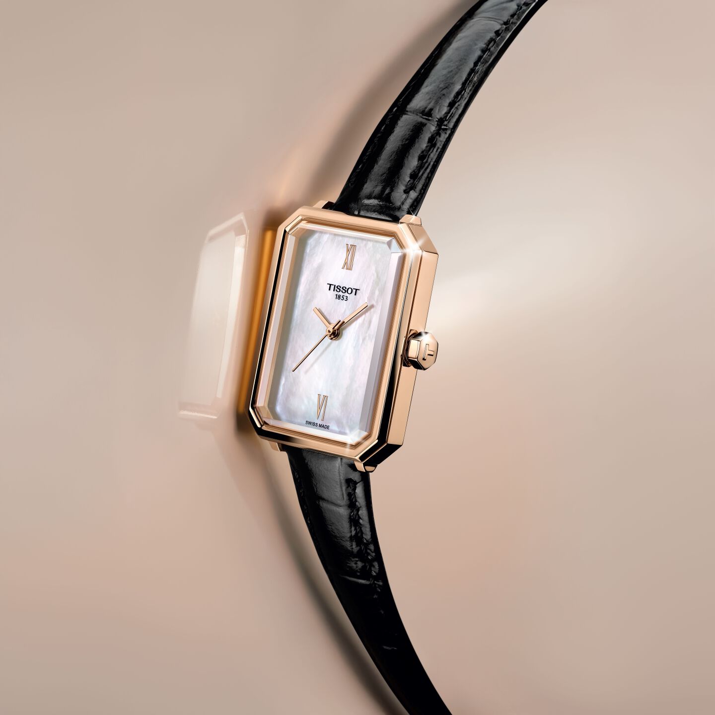 angled Tissot SRV watch against beige background