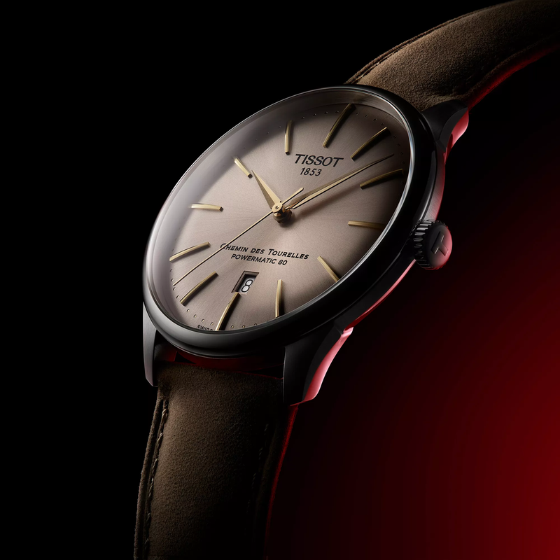 天梭杜魯爾系列42mm watch on a colored background