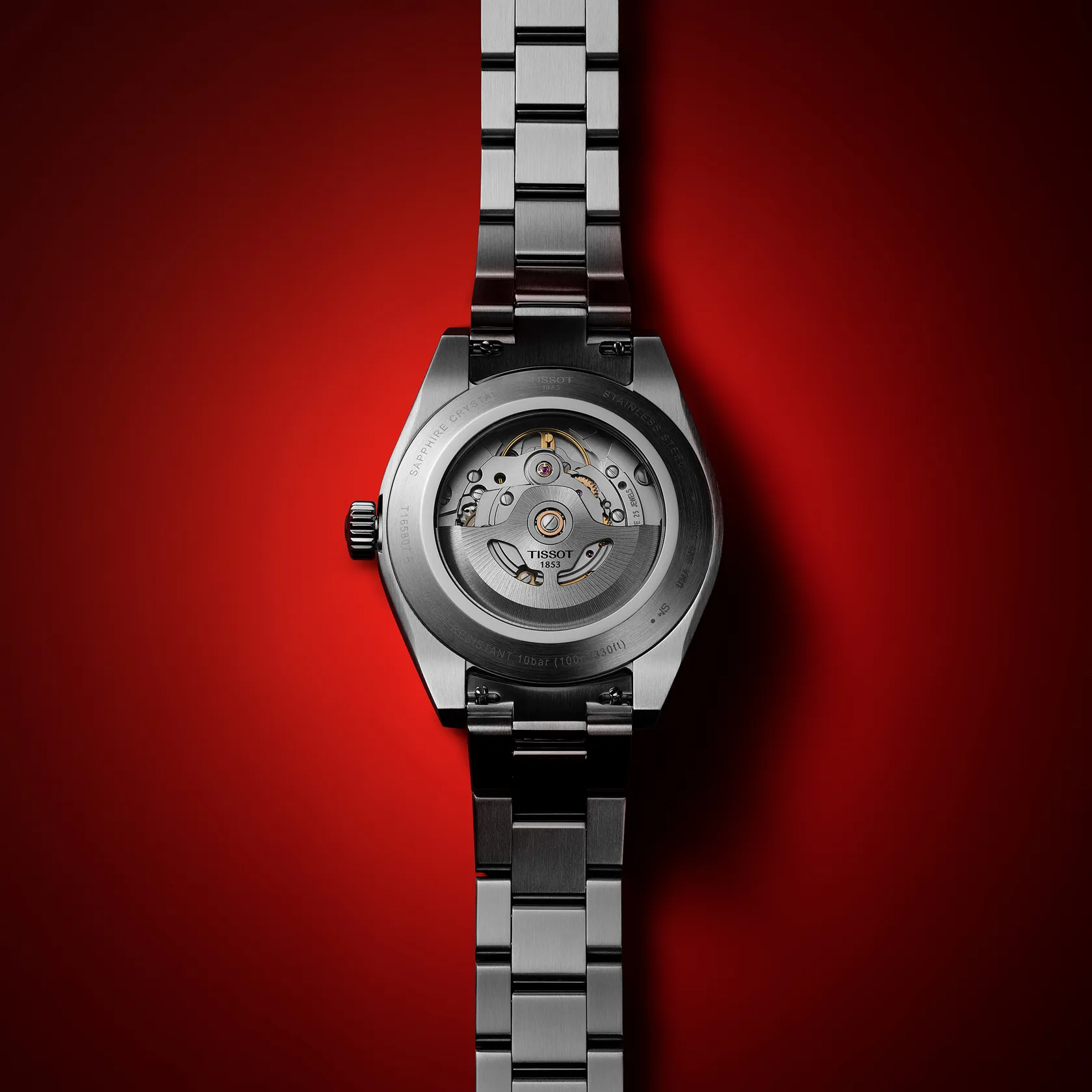 天梭紳士系列38mm watch on a colored background