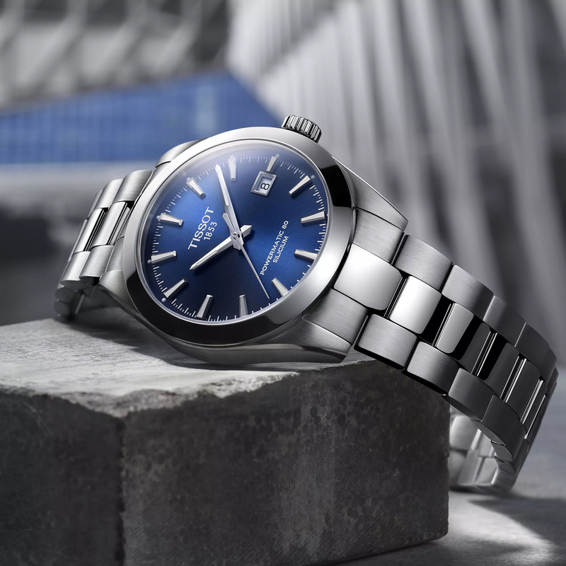 Tissot Gentleman 40mm watch on a colored background