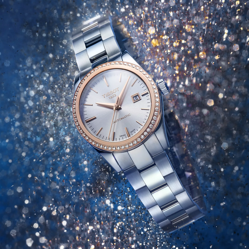 Tissot T-My Lady Gold 29mm watch on a colored background