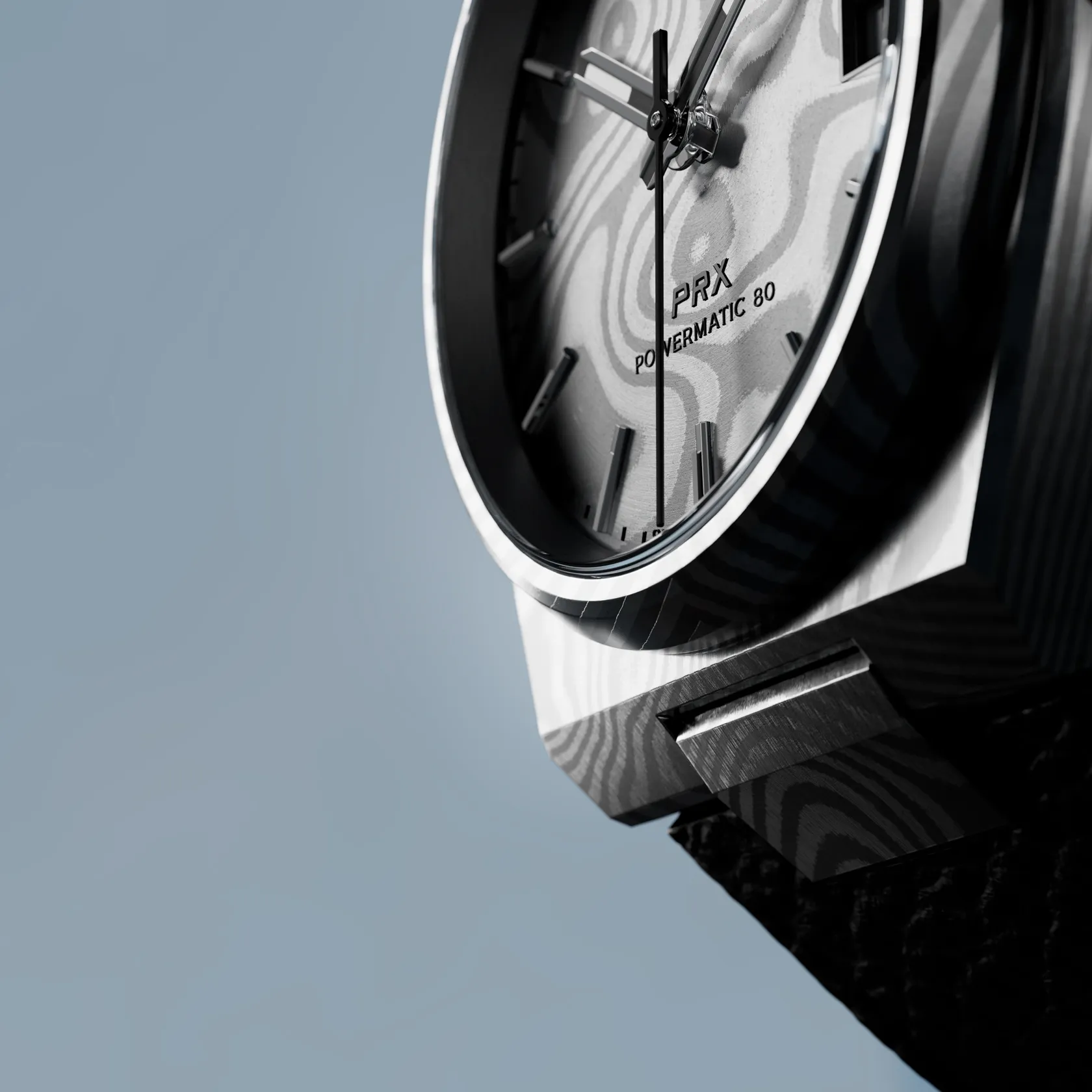 Tissot PRX Damascus Steel 38mm watch on a colored background