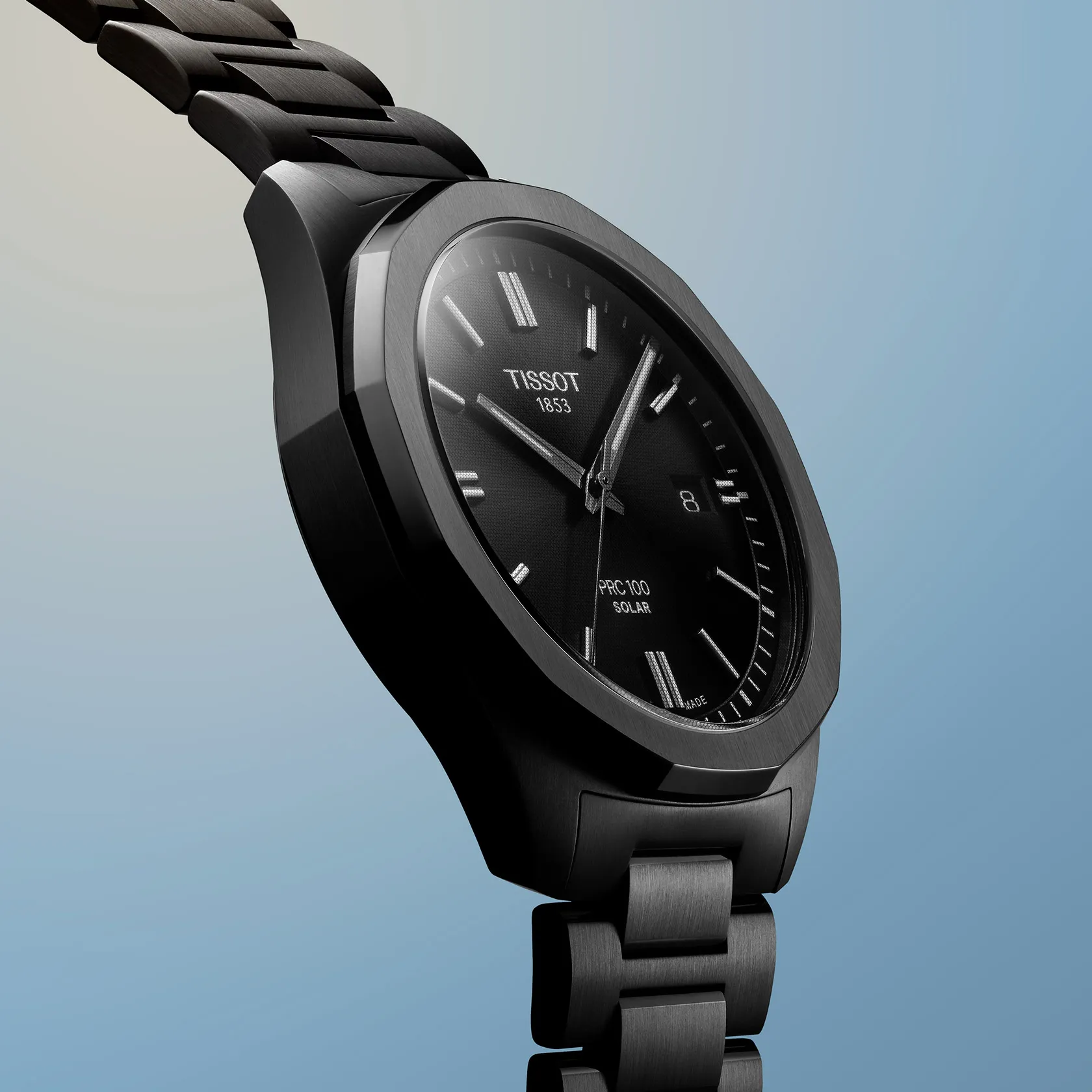 Tissot PRC 100 Solar 39mm watch on a colored background