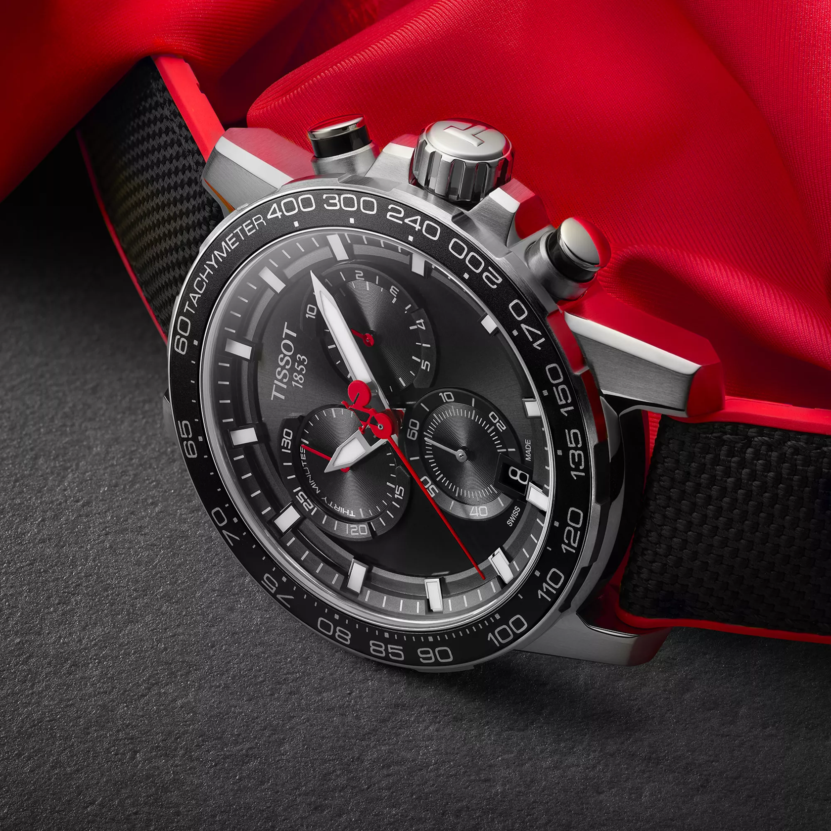 Tissot Supersport Chrono Vuelta Special Edition watch on a colored background