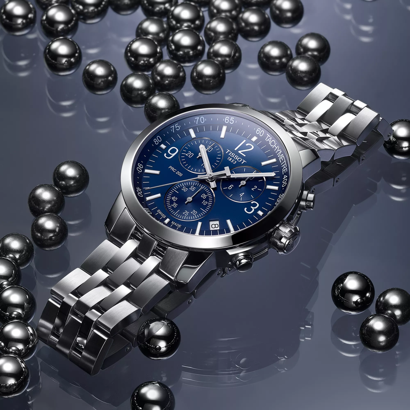 Tissot PRC 200 43mm watch on a colored background