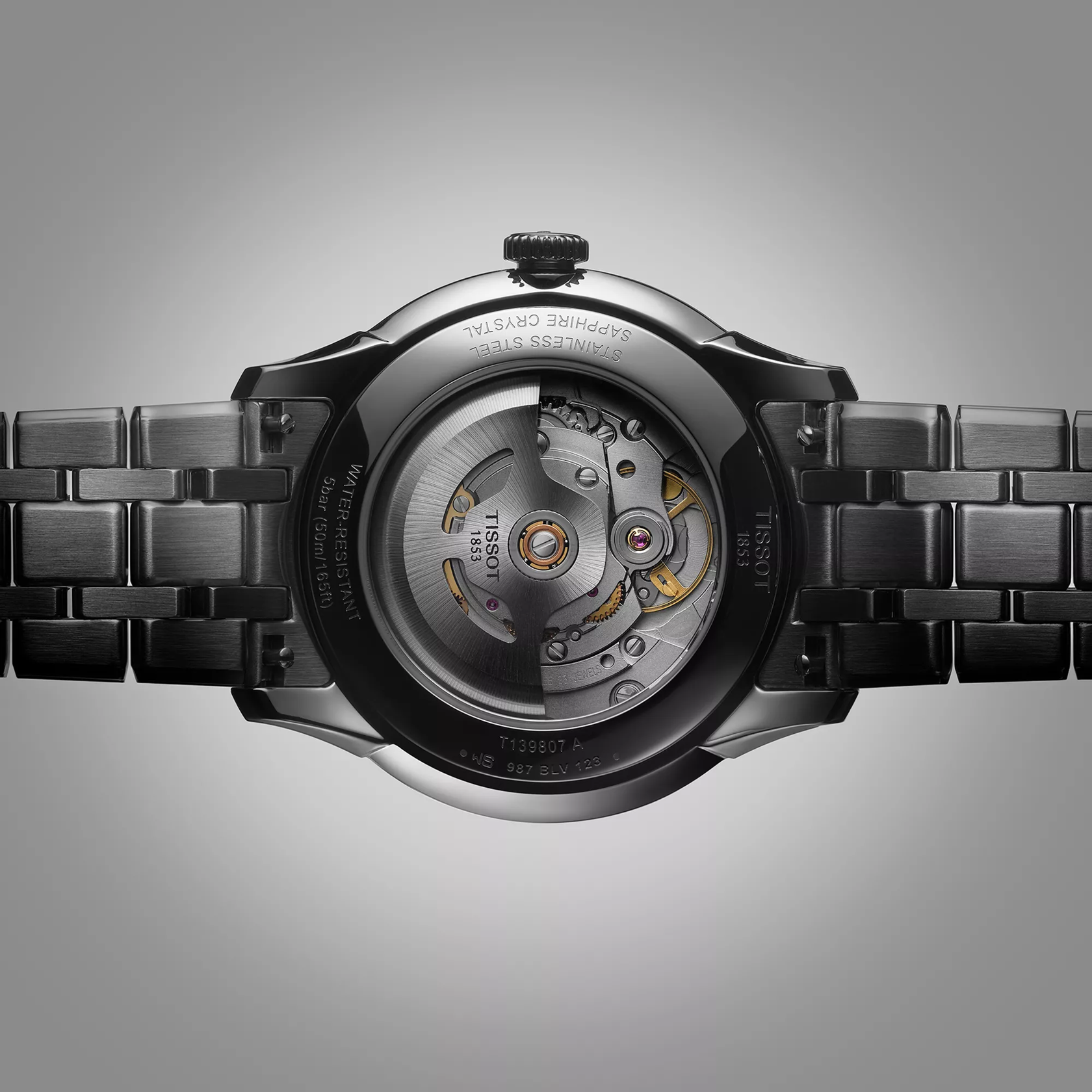 Tissot Chemin des Tourelles Powermatic 80 39 mm watch on a colored background