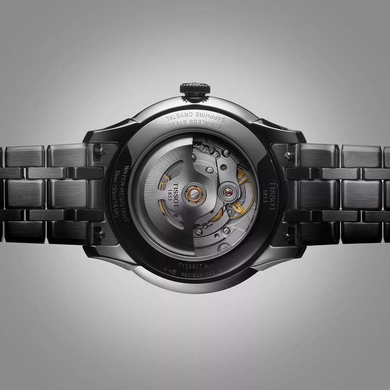 Tissot Chemin des Tourelles Powermatic 80 39 mm watch on a colored background