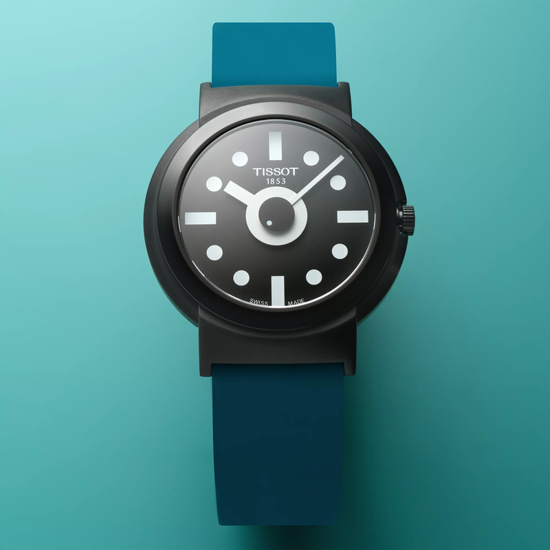 Tissot Heritage Memphis Gent watch on a colored background