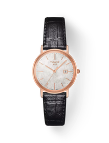 그림자가 있는 티쏘 골드런 레이디 18K 골드 시계의 전면 보기