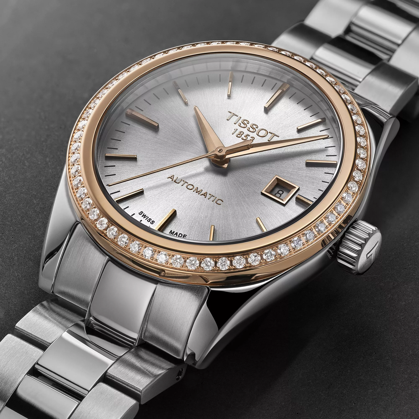 Tissot T-My Lady Gold 29mm watch on a colored background