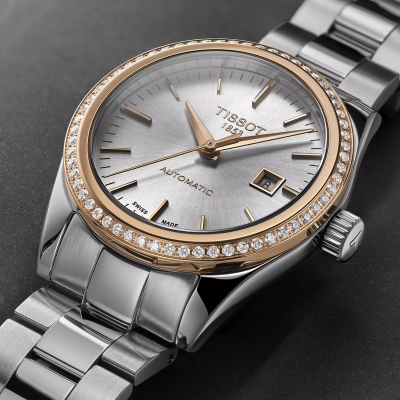 Tissot T-My Lady Gold 29mm watch on a colored background