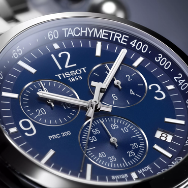 Tissot PRC 200 43mm watch on a colored background