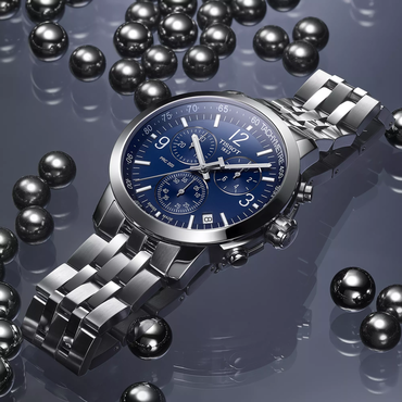 Tissot PRC 200 43mm watch on a colored background