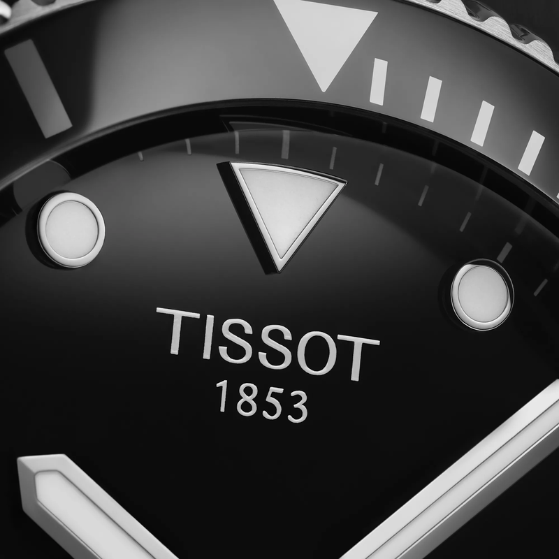 Tissot Seastar 1000 40mm watch on a colored background