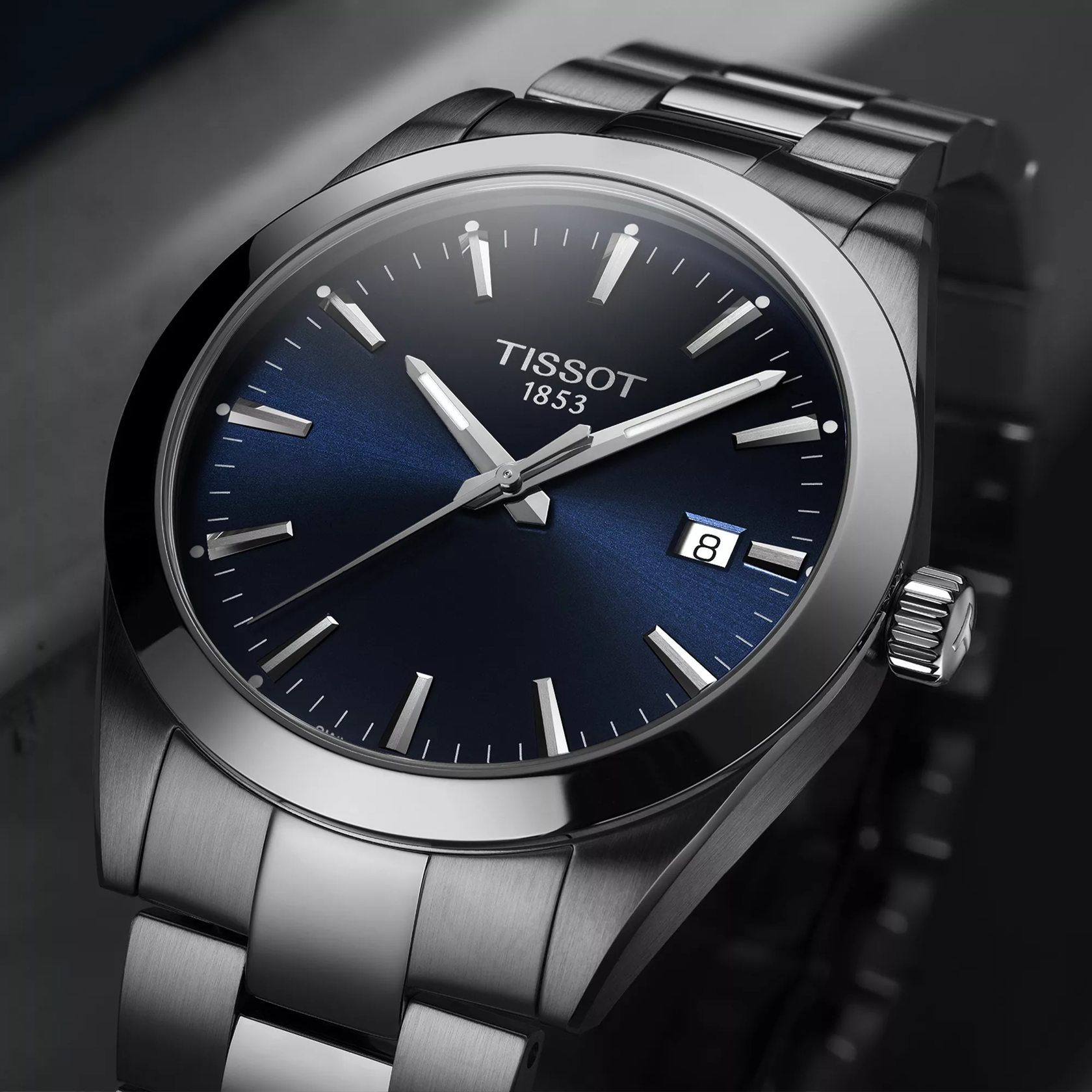 Tissot Gentleman 40mm watch on a colored background