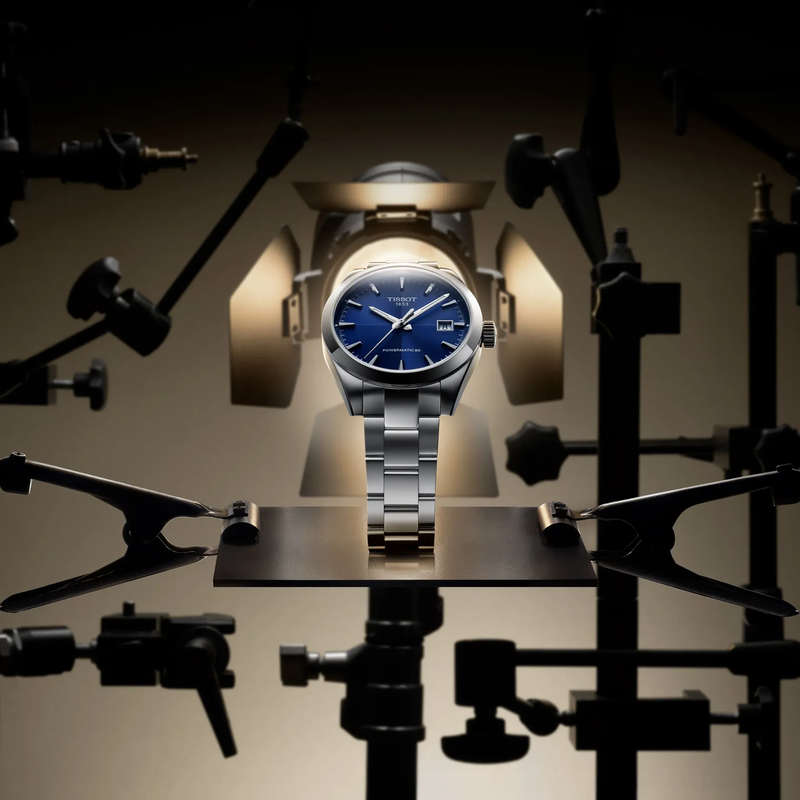 天梭紳士系列38mm watch on a colored background
