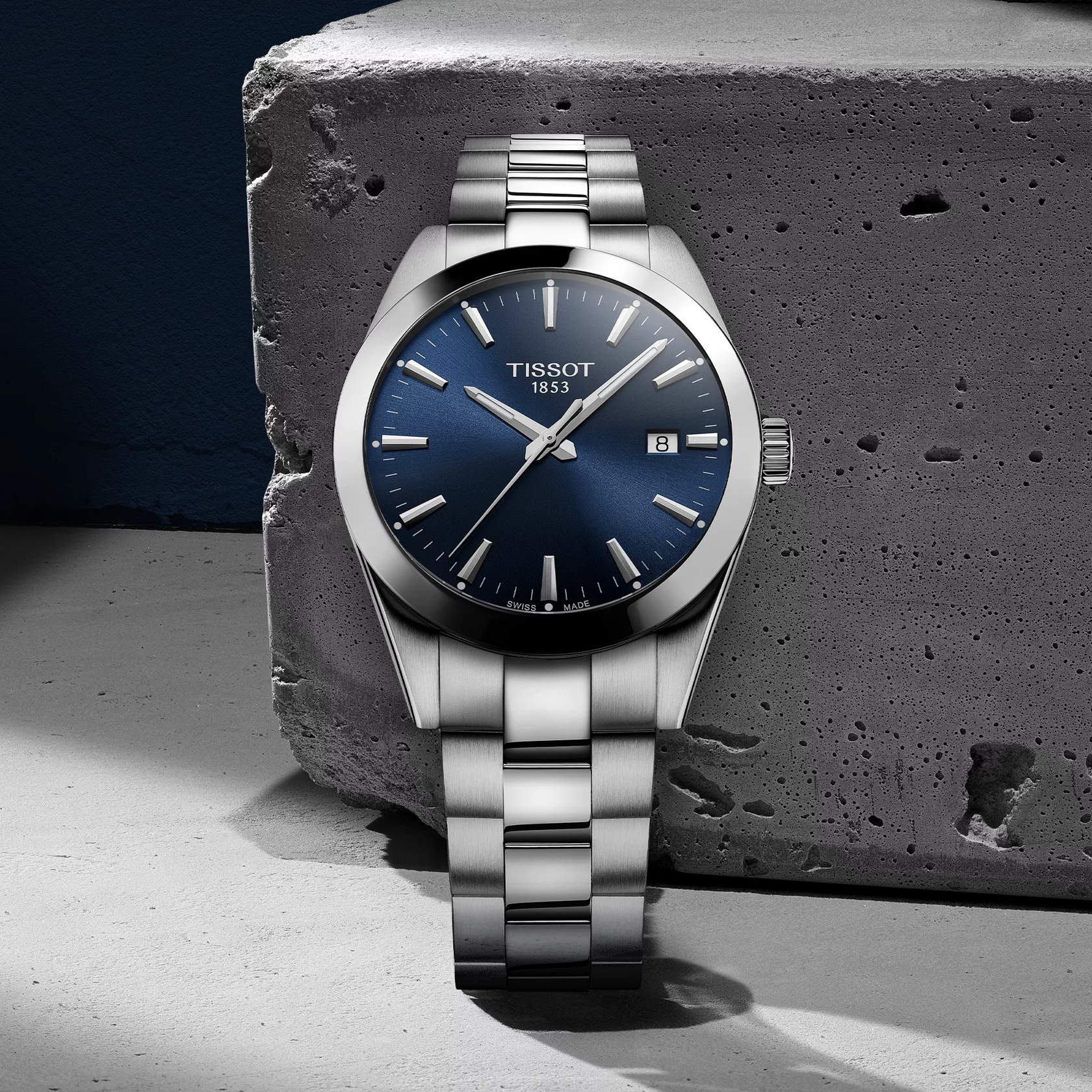 Tissot Gentleman 40mm watch on a colored background