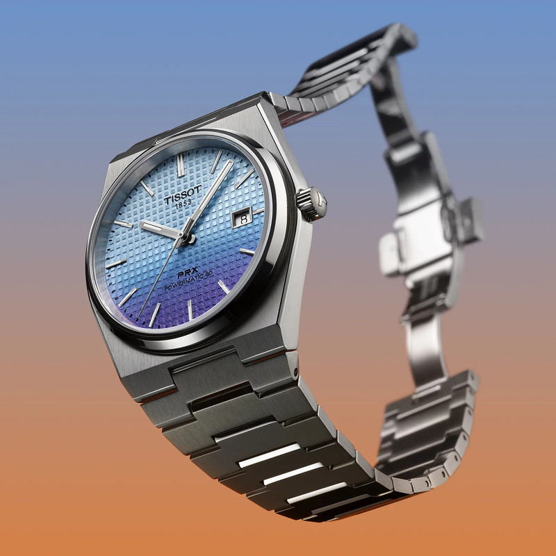 Tissot PRX 40mm watch on a colored background