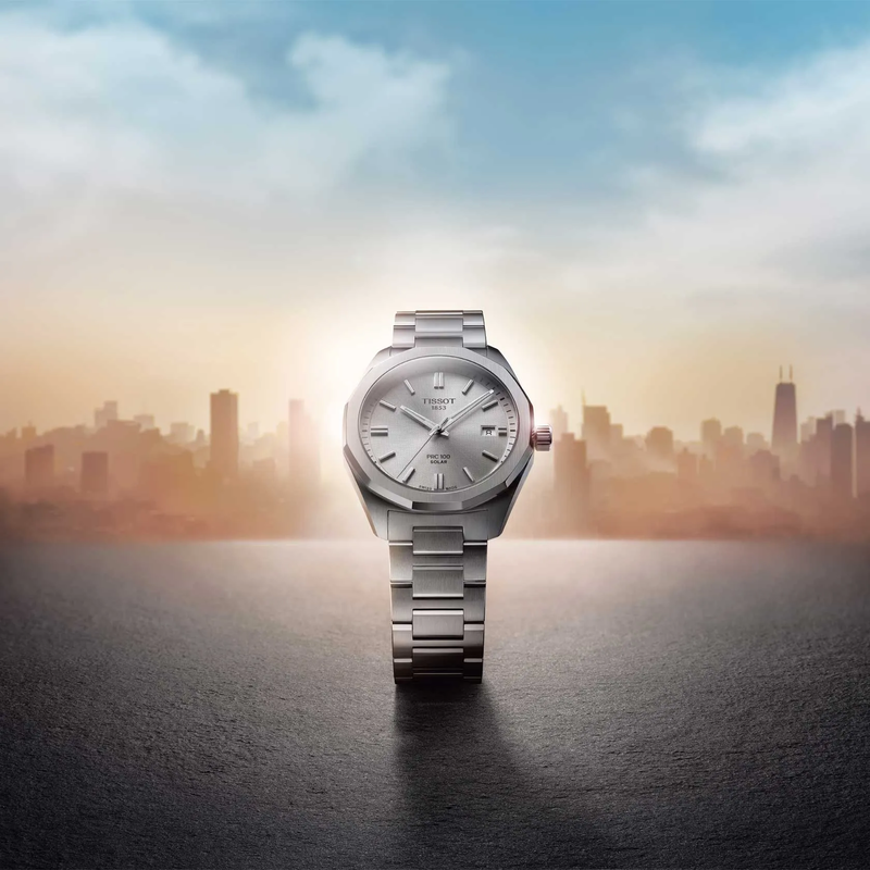 Tissot PRC 100 Solar 39mm watch on a colored background