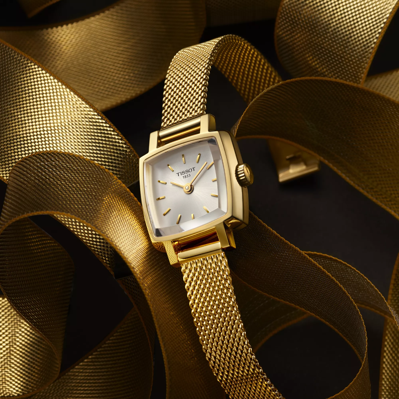 Tissot Lovely Square 20x20mm watch on a coloured background