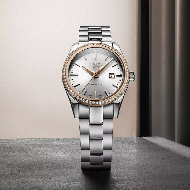 Tissot T-My Lady Gold 29mm watch on a colored background