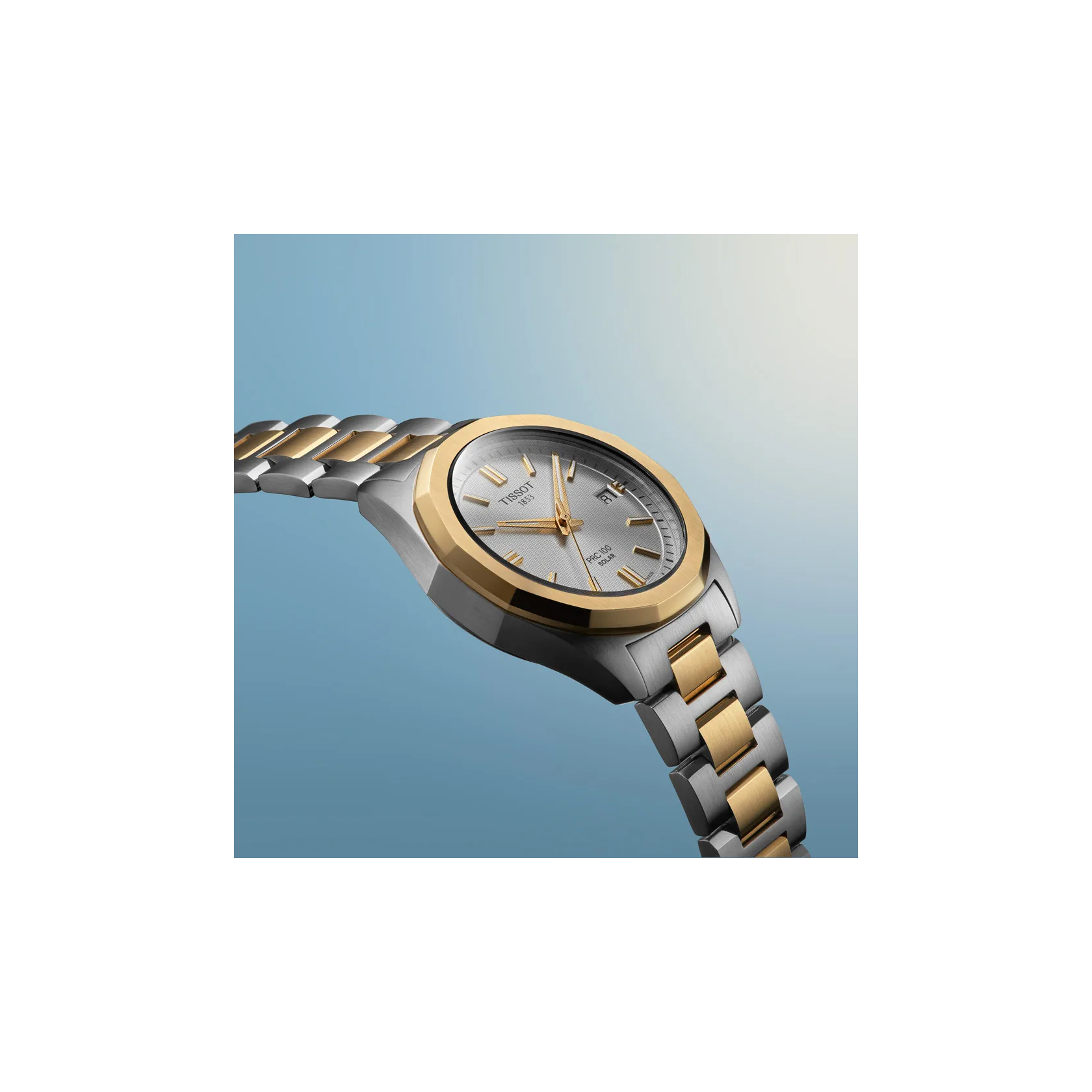 Tissot PRC 100 Solar 34mm watch on a colored background