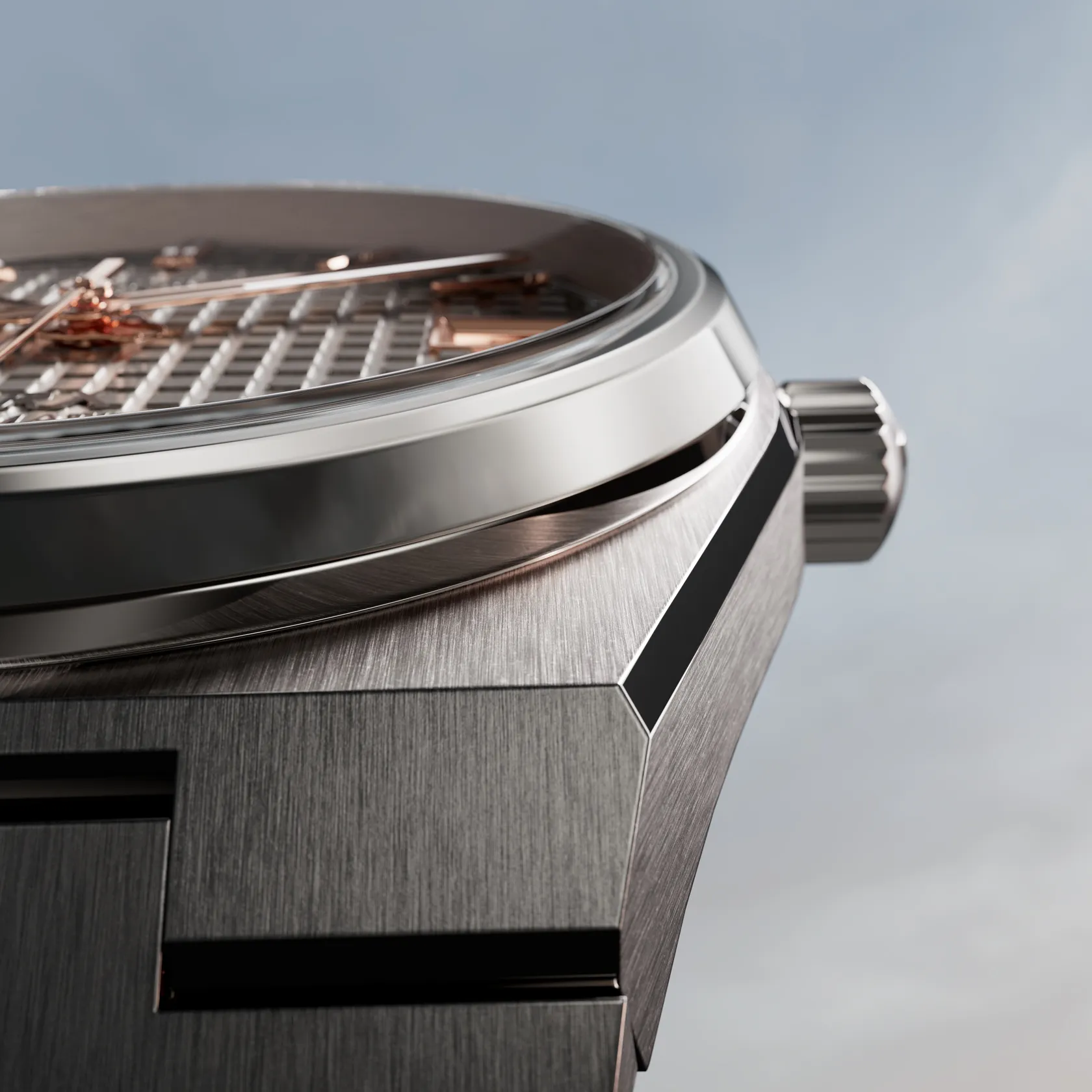 Tissot PRX Titanium 38mm watch on a coloured background