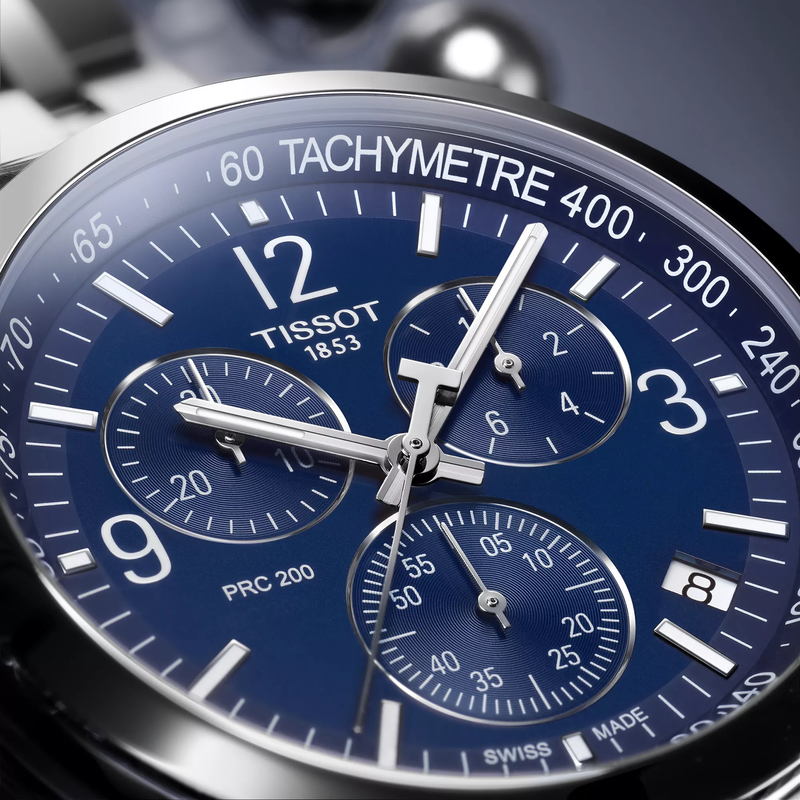 Tissot PRC 200 43mm watch on a colored background