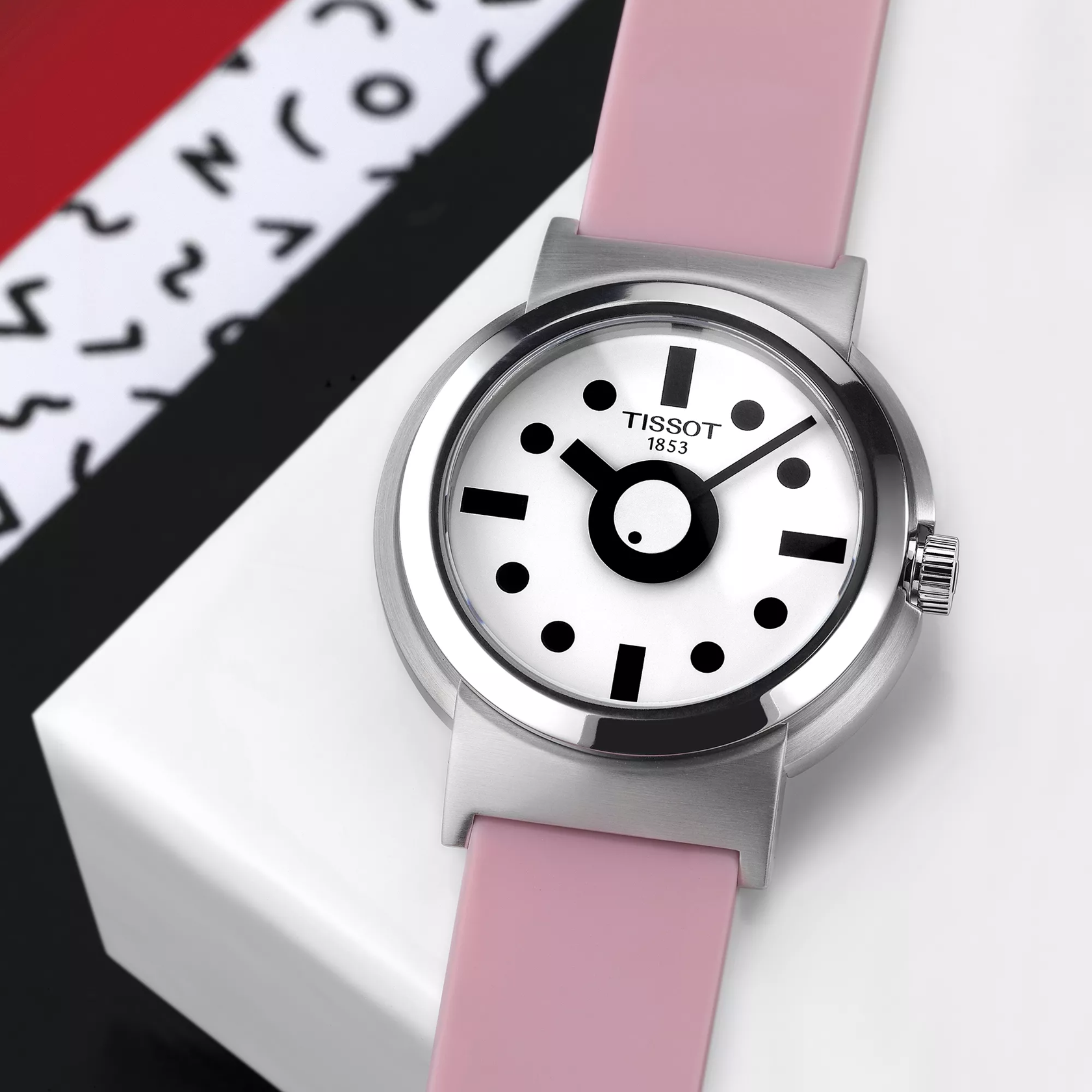 Tissot Heritage Memphis Lady watch on a colored background