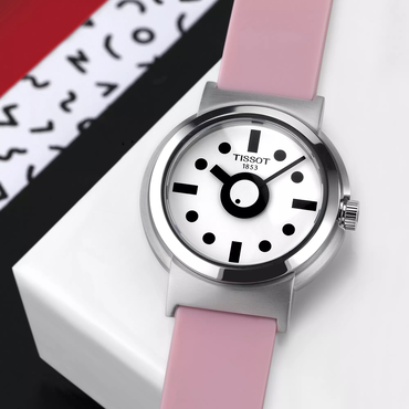 Tissot Heritage Memphis Lady watch on a colored background