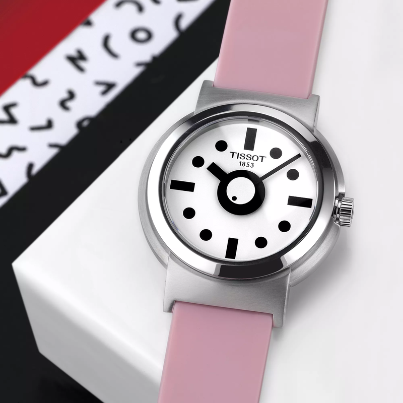 Tissot Heritage Memphis Lady watch on a colored background