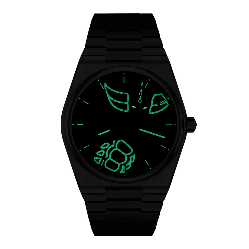 Vista frontal del reloj Tissot PRX UFO Robot Grendizer 50th Anniversary 40mm en modo nocturno