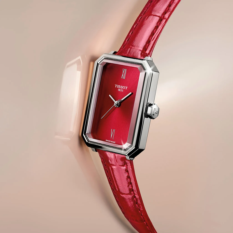 Tissot SRV 30mm watch on a colored background
