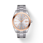 그림자가 있는 티쏘 젠틀맨 파워매틱 80 실리시움 솔리드 18K 골드 베젤 시계의 전면 보기