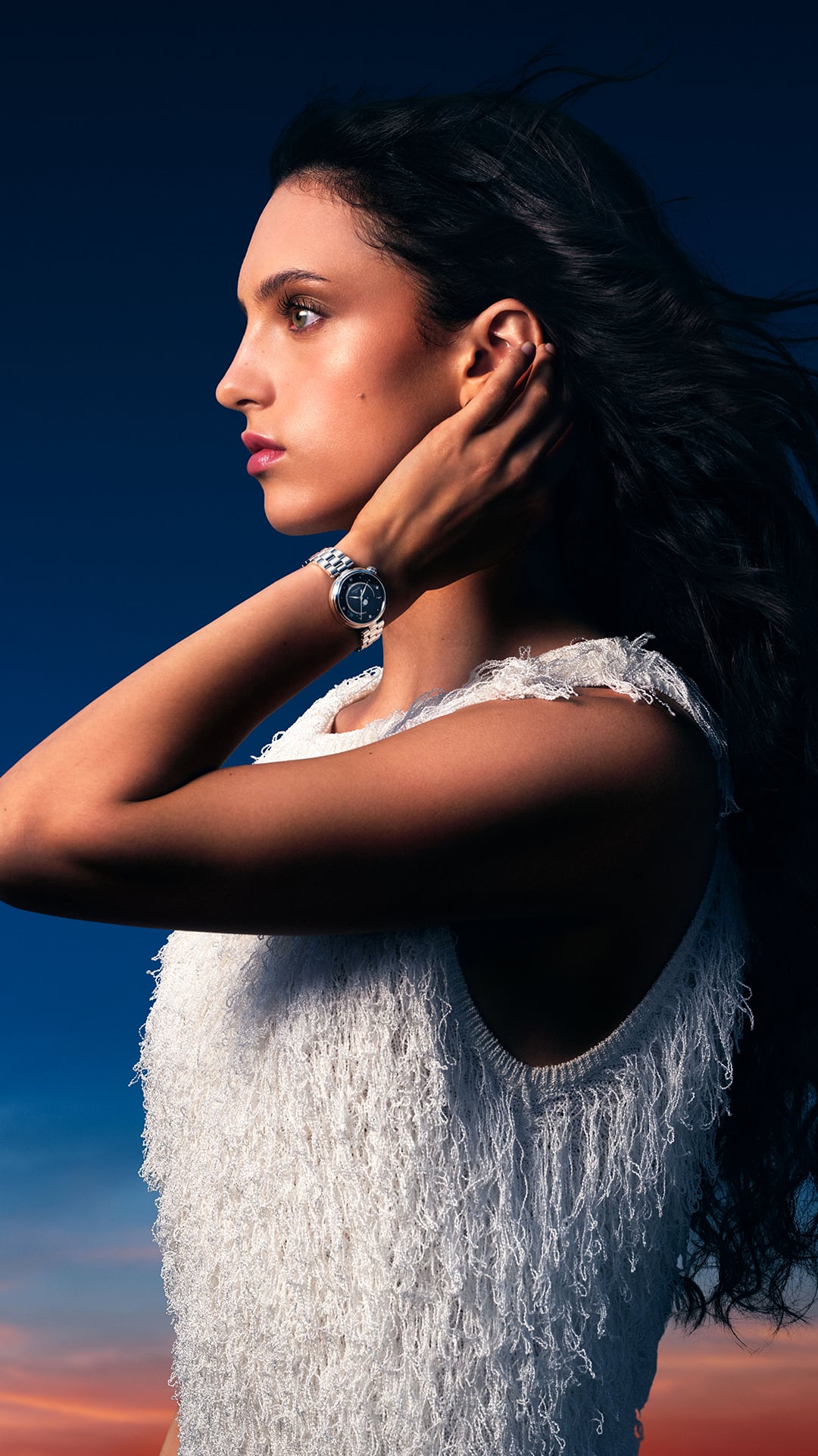 Woman wearing the Tissot Désir Moonphase at night