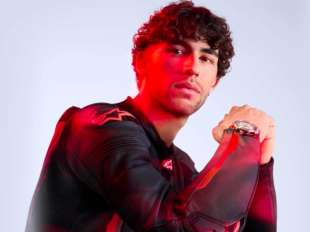 Enea Bastianini with red glow, wearing a Tissot watch 