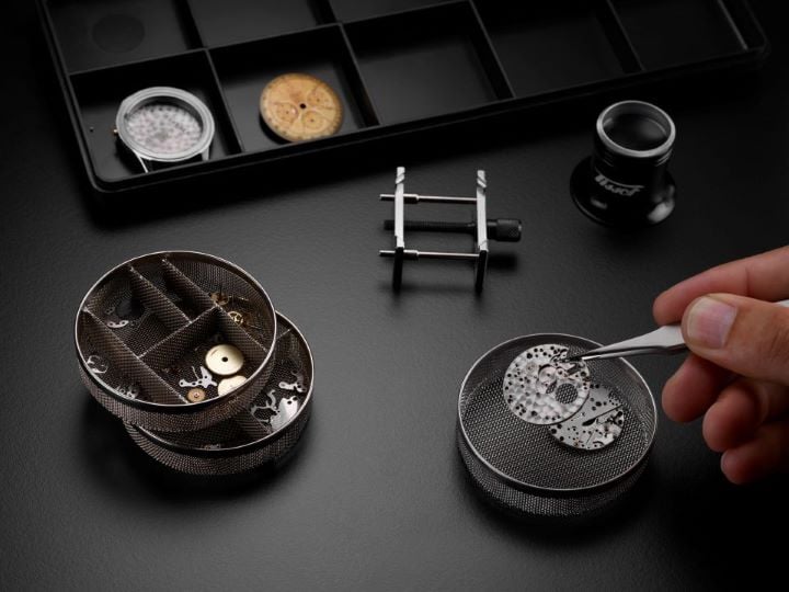 Set of Tissot watch components displayed together.