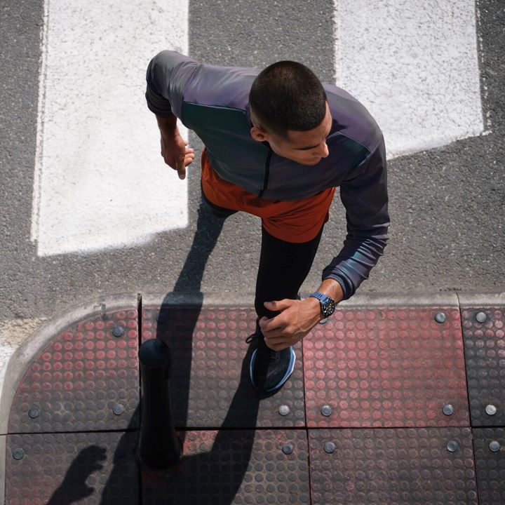Overhead shot of a runner wearing the new blue t-touch connect sport