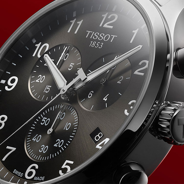 Men driving a red car, wearing a PR516 watch