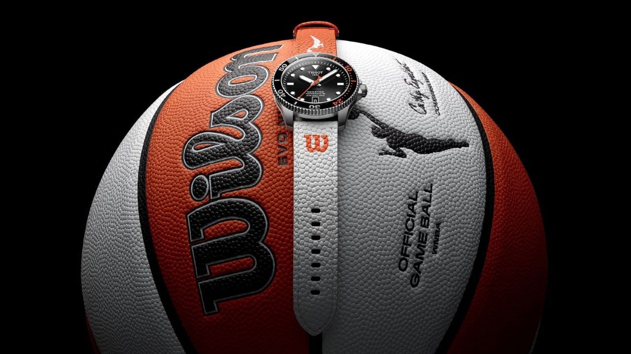 Tissot Seastar Wilson WNBA model with orange and white strap, set on the official WNBA Wilson basketball.