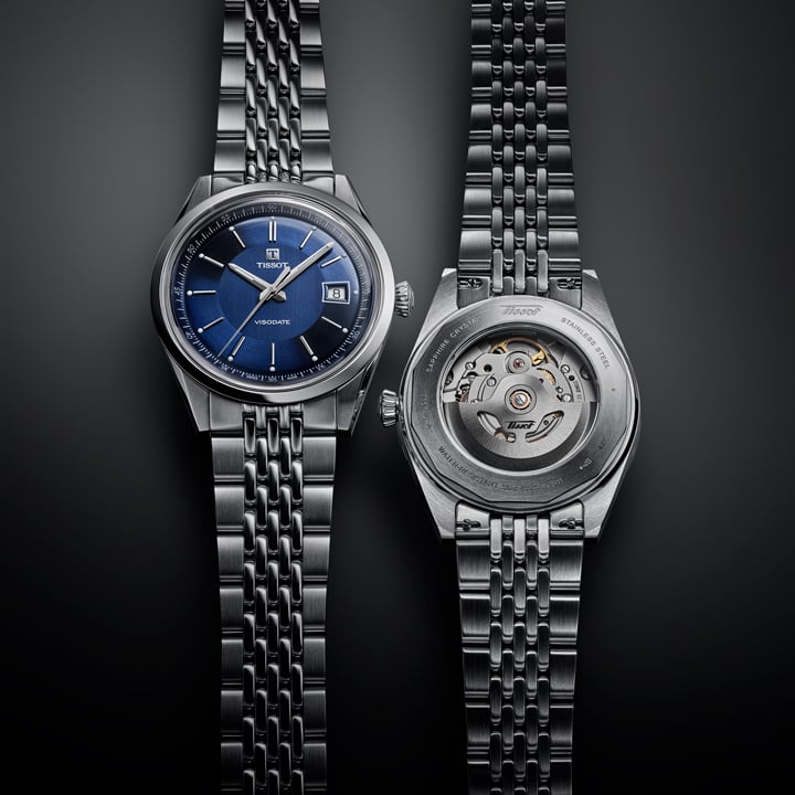 Tissot Classic automatic men's watch with a blue dial shown from the front and transparent caseback.