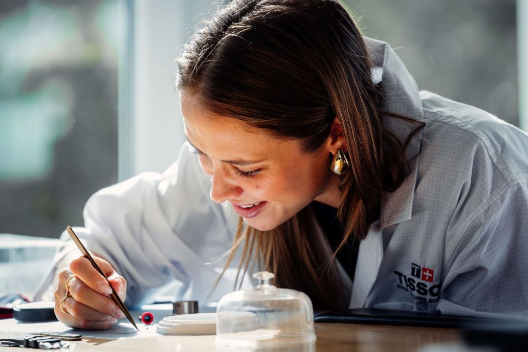 Agathe Teyssier trying his hand at precision watchmaking on a Tissot watch