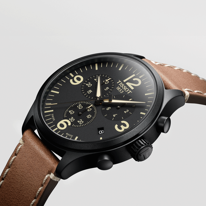 Close up of a Tissot Chrono XL with a black dial and brown leather strap