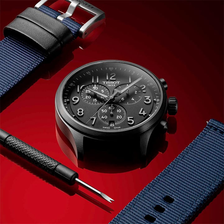 Black Chrono XL case surrounded by compatible dark blue straps