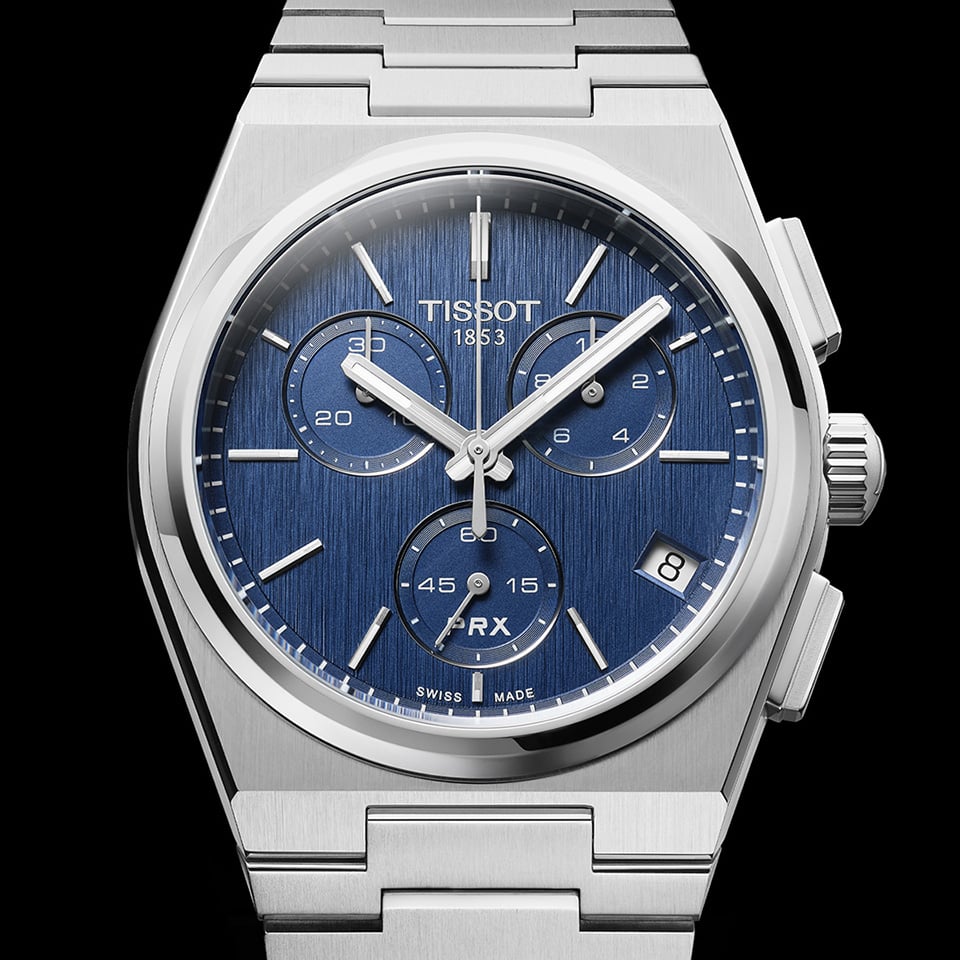 The blue-dial PRX Quartz Chronograph on its integrated bracelet.