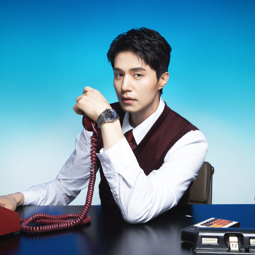 Men driving a red car, wearing a PR516 watch